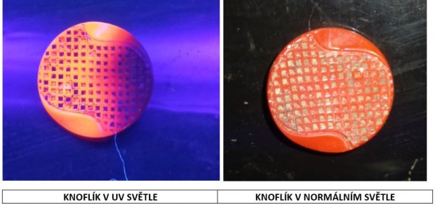 Knoflík zářící červeně v UV světle.